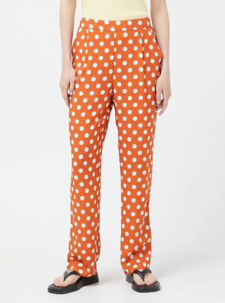 Pantalon orange à pois blanc Compania Fantastica vendu à Montréal.