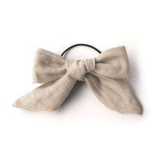 Élastique avec une grosse boucle sable GIBOU. Montreal designer boutique.