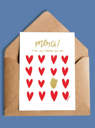 OUI MANON Carte - Merci! T'as un coeur en or, avec un cœur humain doré au milieu de cœurs rouges. Fait localement à Montréal.